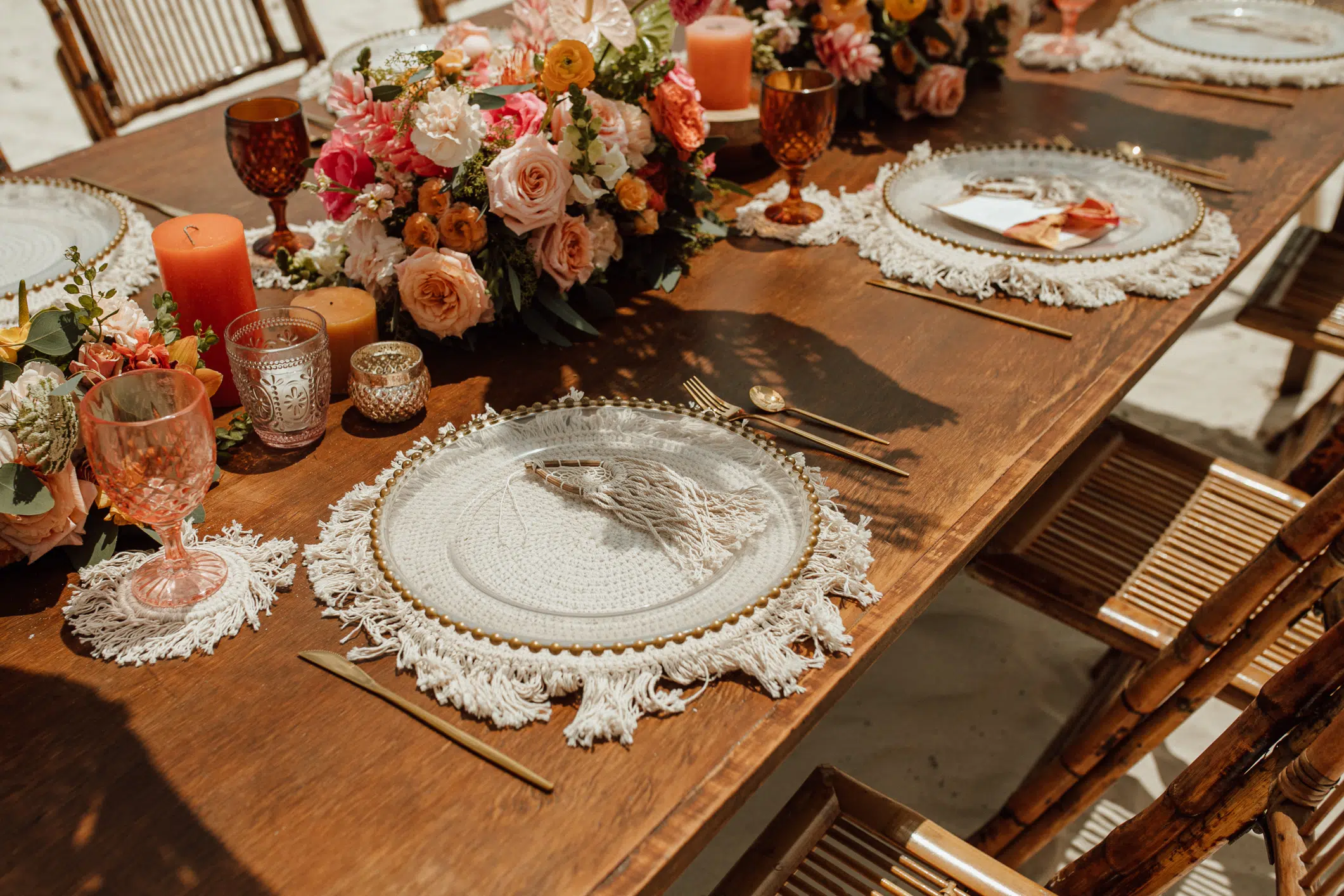 Place setting with fringed charger and fresh flowers